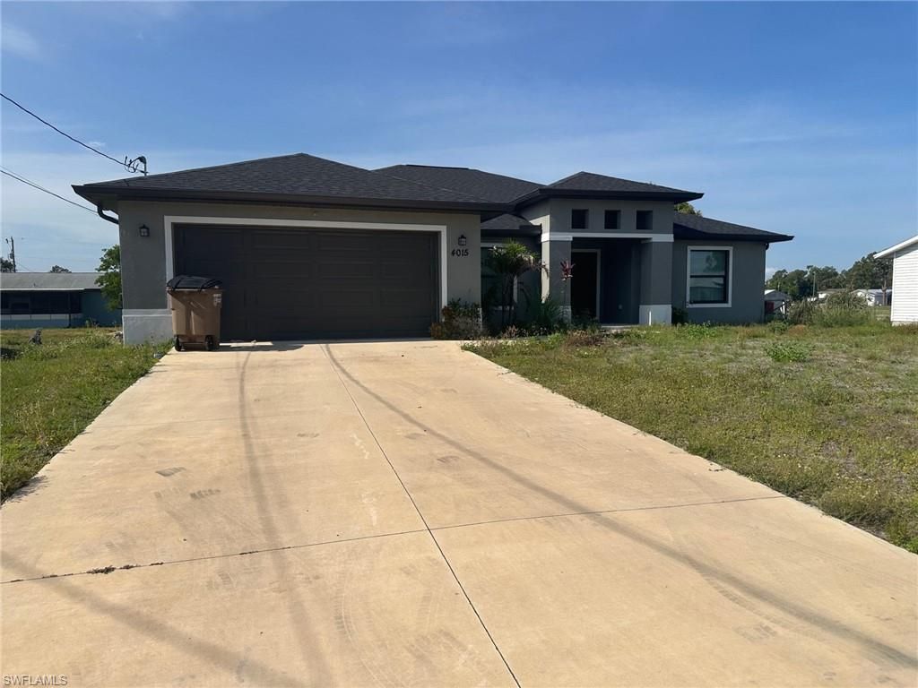 Photo of 4015 6th ST W, LEHIGH ACRES, FL 33971 (MLS # 226019581)