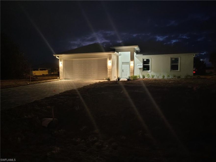 Ready to move into this beautiful 2026 new construction home? Close to schools, shopping, dining, parks and more! This custom home offers 1,532 sq ft of living area, with 4 bedrooms and 2 baths. The main living area features a vaulted ceiling that connects seamlessly to the dining area and a large freestanding island with a granite countertop. The kitchen pantry boasts designer wood cabinetry, granite countertops, and stainless steel appliances. All windows and doors are impact-resistant. Sliding doors in the family room provide direct access to an oversized tile lanai, and the house features tile throughout. The private master suite includes a recessed ceiling with a raised center panel, two walk-in closets, and a spacious bathroom and shower with a wood designer vanity, dual sinks, and granite countertop and privet toilet. On the opposite side, of the house there are three bedrooms that share a guest bathroom, linen and that have a designer wood vanity and a granite countertop. The home features oversized 18.5-foot garage door openings for two vehicles, three smart flood vents for water and debris exits, which may potentially reduce insurance costs, and a oversized paver driveway that accommodates four SUVs. Sprinklers throughout the house and a septic lift station for the sewer system that prevents sewage backups and odor issues. Proper design helps prevent waste from sitting too long, which can cause bacteria growth and odors.