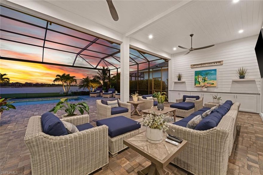 Located in the Luxury Waterfront community of WildBlue, this home has a perfect blend of coastal living, luxury comfort, and impressive energy efficiency! Designed to embrace its stunning lakefront setting, it captures the relaxed, boatable lifestyle that draws so many to SW Florida. Offering over 2,900 sqft, 4 bedrooms, 3 full bathrooms with thoughtfully curated décor makes this home move-in ready!

Custom detailed woodwork, soaring 12-ft ceilings, and expansive 10-ft impact-rated windows and door walls create a light-filled interior that beautifully frames the water. The open-concept design is complemented by plank tile flooring throughout and a Gourmet Kitchen featuring an oversized island, quartz countertops, stainless steel appliances, natural gas, crown molding, elegant window treatments, and upgraded fixtures. Solar electricity enhances energy efficiency with an estimated $3,000 in annual savings!

The outdoor living area is an entertainer’s dream, featuring a sparkling pool and spa, picture-frame lanai screen, oversized pool deck, built-in outdoor kitchenette, and custom tongue-and-groove ceiling, upgraded fans and lighting, also equipped with Storm Smart hurricane protection for added peace of mind. 

A truly unique highlight is the custom mural by DeMott Design, an artistic tribute to Andy Rossi Lane on Captiva Island and the iconic Mucky Duck, adding a distinctive island-inspired ambiance to the billiards room!

Additional highlights include a well-appointed garage with epoxy flooring, custom cabinetry, overhead storage racks, and a 22KW whole-house Generac generator. 

Enjoy world-class resort amenities including boating, tennis, pickleball, fitness, indoor/outdoor dining and spa within the prestigious, gated WildBlue Community. Short drives to shopping, dining, RSW airport, beaches and I-75 make this location ideal for full and part-time homeowners!