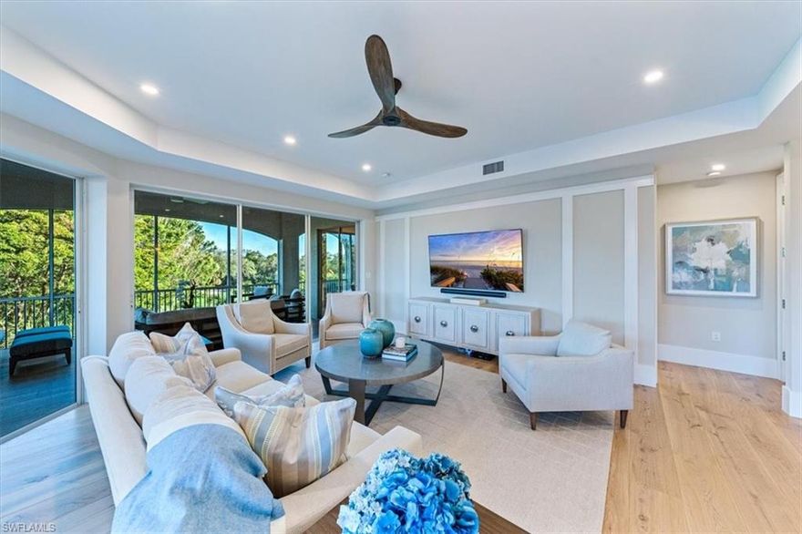 C8992 - This Completely remastered and remodeled golf course view condo is designer furnished and move-in ready! New features throughout the unit include 10’ ceilings, wide-plank hardwood floors, quartz countertops, recessed and decorative LED light fixtures, ceiling fans, plumbing fixtures, solid interior doors and hardware, 10” base trim, frameless glass shower enclosures, and 1Gig fiber internet with wi-fi boosters. The owners’ suite boasts a sitting area/workspace, 65” TV. The bright and spacious owners bath boosts dual vanities, make-up vanity, free standing tub and dream walk-in custom closet. The VIP guest suite offers a huge closet, separate sitting area with TV, and bathroom featuring dual vanities and a walk-in shower. The kitchen, open to the great room and golf-course views, features a Kitchen aid appliance package with a microwave drawer and custom range hood. The generously sized dining room accommodates 8 and makes hosting a breeze with a built-in buffet and wet bar that includes refrigerator drawers and an under-counter wine refrigerator. An expanded laundry room with folding counter and full-wall storage is conveniently accessible from the owners’ suite.