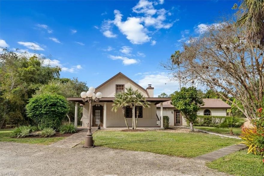 Welcome to this exquisite and unique 3 bedroom 21/2 bathroom country estate in Naples, where in-town country living meets modern convenience and natural beauty! Nestled on 2.27 fenced and cleared acres, with automatic rod iron front entry gates and metal roof. This property boasts a bounty of mango, banana, starfruit, and lychee trees, offering a serene orchard experience. Step inside to discover the warmth of finished pine ceilings, walls, closets, and doors, accentuated by an expansive pine wood staircase leading to the second floor. The heart of the home features large loft, a beautiful brick fireplace, stunning formal dining room with decorative French doors, complemented by a beautiful updated kitchen with stainless steel appliances, Corian countertops, tiled backsplash, with an added bonus of plantation shutters and tile floors throughout the home. Enjoy the peace of mind provided by an entire house reverse osmosis system with an extra-large water holding tank and a secure gated entry. Located just moments from grocery stores, parks, shopping, schools, and restaurants, and 30 minutes to beautiful Naples beaches and historic 5th Ave south. This property perfectly blends rural tranquility with urban accessibility, promising a lifestyle of comfort and ease in Naples.
