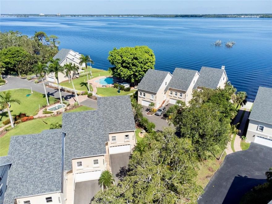 Dreamy waterfront views and spectacular sunsets are what you should expect with this amazing Townhome. 
Steps from the River and your deeded boat slip, this 3-floor home has over 2,400 s/f of living space with 3 bedrooms and 3 baths + two-car garage.  There is a bedroom on each floor.  Tile flows throughout most of the home, with carpet in the master bedroom + one guest bedroom.  The master (top floor) and lower bedroom have an open porch.  The main living area offers a screened porch with new "super lanai screens."  Light, bright, and open this home has elegant touches throughout - plantation shutters and designer window treatments, fresh paint, and granite counter tops.  New roof in 2023, AC condenser 2022, Air handler 2020, hot water tank approximately 4 years old, and, appliances new in 2016.  Agents, please see confidential comments.  You are now HOME!