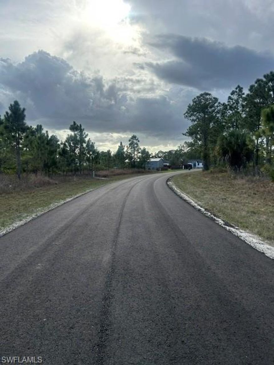 Slightly oversized buildable lot with a brand new paved road and power at the street! Conveniently located just off Genoa Ave & Milwaukee Blvd with quick access to State Road 82 for an easy commute. Surrounded by new construction throughout this desirable yet quiet neighborhood, this property is ideal for your dream home or a smart future investment. Build now or hold for long-term appreciation!