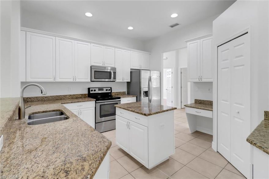 This remarkable single-level 4-bedroom + den home is nestled on a sprawling 2.5-acre lot, offering an exceptional combination of luxury and functionality. The open floor plan is highlighted by high ceilings and tile flooring throughout the living areas, with warm laminate in the bedrooms for a cozy touch.

The updated kitchen is a chef’s delight, featuring granite countertops, a large center island, stainless steel appliances, and built-in cabinetry for ample storage and style. The formal dining room, breakfast nook, and separate family and living rooms provide versatile spaces for entertaining and everyday living.

The spacious master suite is a true sanctuary, boasting two large walk-in closets and a transom window that brings in natural light. Outside, an oversized lanai invites you to enjoy the tranquility of the expansive property, while the garage features a sleek epoxy-coated floor for added utility and appeal.

This home is perfect for those seeking a blend of modern design, thoughtful details, and serene surroundings.