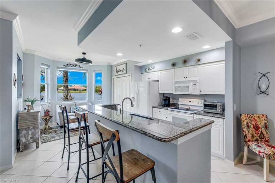 Immaculate FORMER MODEL with EXPANSIVE WATER VIEWS! Well appointed, light, bright and a FIRST FLOOR Beauty! The Owners took exceptional care and enhanced along the way with New AC 2024, Plantation Shutters, Window Treatments, CUSTOM PAINT, Shower Door(s). The unit is spotless. THE ANCHOR OF ESTERO- Bella Terra spans across 500 acres of natural beauty, including 100 acres of tranquil lakes and 400 acres of lush conservation preserves. Residents enjoy access to a world-class 7,000 sq. ft. clubhouse featuring a state-of-the-art fitness center and a resort-style pool complete with a spa and waterfall. The amenity-rich lifestyle continues with a secondary ancillary pool, pickleball, tennis, bocce, and basketball courts, as well as multi-use ball fields and a beach volleyball court. For those seeking unique recreation, the community also boasts an inline skate park, a serene butterfly garden, and a dedicated tot-lot playground. Whether you are relaxing in your bright, updated first floor condo or exploring the vast nature preserves, this property offers a rare combination of modern reliability and resort-style luxury.