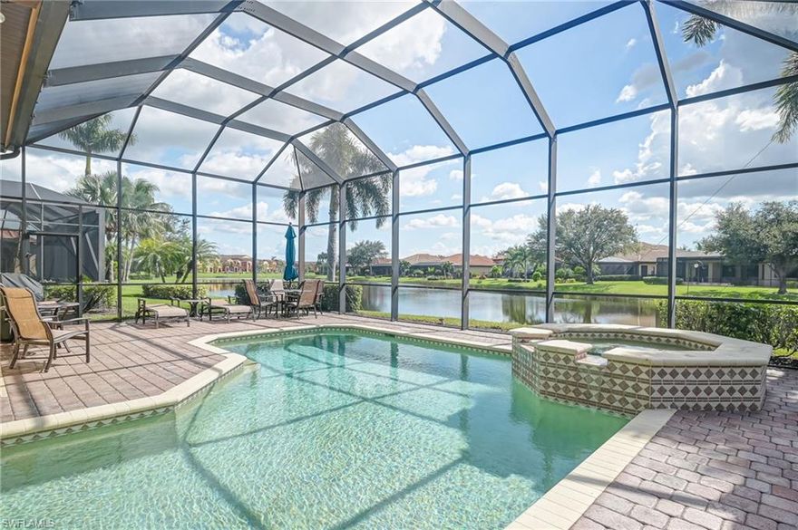 Rarely available in Paseo, only 4 of this floor plan, in whole community. WATERFRONT, TURNKEY FURNISHED, FLORENCE model with POOL AND SPA! This 3 bedroom with den area, 2 full bath home is loaded with upgrades and decorated with coastal flare. From the high end ivory cabinetry, top of the line fixtures and lighting, granite countertops, central vac, to the hurricane impact glass windows and doors along with electric roll down shutters for added peace of mind. Great waterfront location with Southern exposure, extra large lanai. Tile roof is only 4 years old. Way too much to list, definite must see!. PASEO VOTED COMMUNITY OF THE YEAR 9 YEARS IN A ROW!! Come relax by the RESORT STYLE POOL or enjoy a beverage at the TIKI BAR. Watch a game at the PUB or enjoy brunch at the BISTRO. Grab a friend and watch a movie in the cinema or work out in the FULLY EQUIPPED GYM. New lighted bike path will connect you to Lee County bike trail system. Enjoy a game of doubles on the 6 har tru TENNIS COURTS or join in the fun at the PICKLE BALL COURTS!! Come enjoy the Paseo Lifestyle.