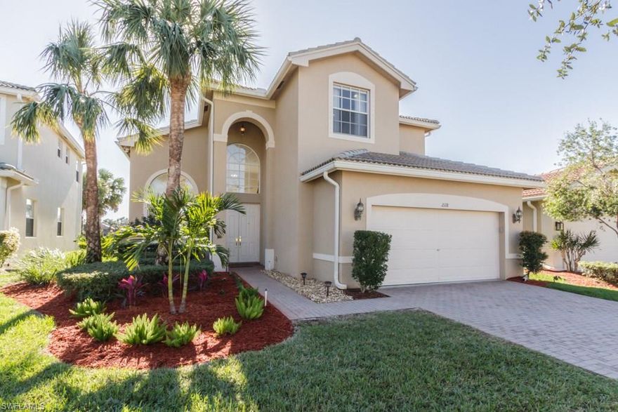 Premium lake front lot with Southern Exposure and terrific Ibis model home.  This wonderful residence offers a very light and bright feeling upon entry, volume ceilings of 20' in the downstairs living areas, tile floors throughout. The lovely Master Suite is on the first floor with a door leading out to the lanai, pool and spa.  The Den offers custom built-ins and a great work space.  Upstairs are 3 spacious bedrooms with a bathroom which all lead downstairs with a solid wood railing.  The lanai is perfect for entertaining with paved decking, the expansive open lake view, pool and spa.  Other features include: new roof (2018), new A/C (September 2017), new hot water heater (August 2017), all new light fixtures and fans throughout the home, new tile flooring upstairs in all bedrooms, California Closets throughout, granite counter tops, Honeywell wireless fixed temperature heat detectors & glass break detectors, new fencing surrounding the pool area, new landscaping & privacy hedges. Saturnia Lakes offers fabulous amenities including several pools, fitness room, dance studio, 4 clay tennis courts, billiards room, saunas, playground, basketball & more.