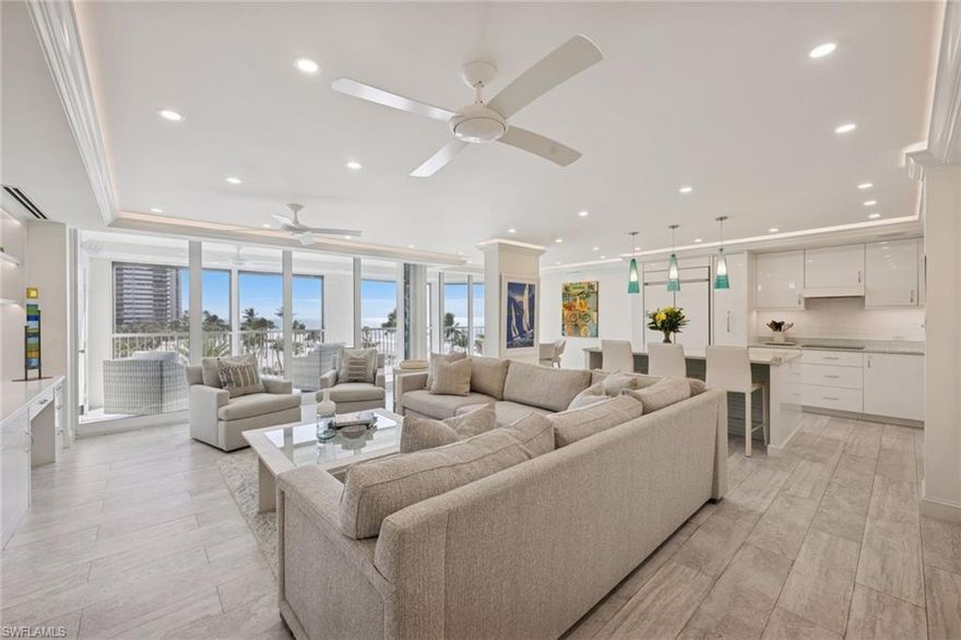 Located in the Park Shore neighborhood of Naples, you will find this completely renovated and upscale residence. The custom millwork, lighting and refined architectural trim add depth and elegance in every room. Enjoy the open concept of living and dining areas all wrapped in natural light. Floor to ceiling glass windows frame the lush park setting and stunning views of the Gulf waters. Sunsets on the lanai feel curated. The kitchen with top-of-the-line appliances, sleek cabinetry and designer fixtures all equal parts functional and style. Each of the three bedrooms is spacious and private. The primary suite is soft and calming with spa-like bath features worthy of a five-star resort. The third bedroom is designed for multipurpose use, including a queen murphy bed. Step outside and the lifestyle truly shines. The building itself is impeccably maintained with attractive common areas and new state-of-the-art systems. Elegant resort-style amenities include a beautiful pool area, modern and well-equipped gym, tennis, putting green, bocce and pickleball along with a shaded gazebo, and outdoor kitchen. Enjoy beach access outside your door for walks, evening sunsets and gulf breezes all wrapped in golden light. Walk to the Venetian village for boutique shopping and dinner or take a quick drive to downtown Naples. This fourth-floor residence in LaMer is refined, state of the art, beautiful and undeniably Naples.