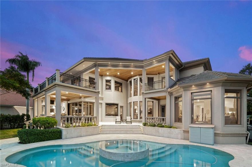 Welcome to one of Fort Myers most stunning riverfront Masterpieces featuring over 6,000 square feet, under air located on nearly half an acre of land and boasting most amazing sunsets in Florida! This mansion immediately impresses by its solid architecture. Once you step through the heavy Cantera iron doors you will be impressed by impeccable craftmanship boasting travertine flooring, elevated tile baseboards, exquisite Venetian plaster, and water panoramas from every angle! The Chef’s kitchen features under-cabinet lighting, top notch appliances, a wet bar with a Turkish ceiling, and lighted onyx countertopst and a wine cellar! The primary suite is accompanied by a sumptuous spa-like bath. 2 balconies offer amazing views of the pool, SPA, and tranquil river ambiance. The 2nd level features an entertainment room, 3 further bedrooms and baths. Enjoy your sundowners in your outdoor kitchen by the fireplace. Further upgrades include a Savant entertainment system throughout the home, a whole home generator, a 10’ elevation, an oversized 3 car garage, Cypress wood ceilings on all outside covered areas and so much more!  Embrace this magnificent riverfront sanctuary, your perfect haven!