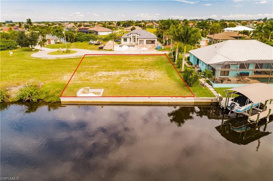 GULF ACCESS--BRAND NEW SEAWALL! ONLY 4 MILES ON SPREADER TO MATLACHA PASS! Come build your Dream Home on this beautiful, western facing Gulf-access building site that sit on 100' wide CanaL. From your boat lift your are just minutes from enjoying the SW Florida gulf waters! Boating access to the Gulf of Mexico, beaches, and surrounding islands such as Cayo Costa, Cabbage Key, Sanibel, Boca Grand. This regular sized property is located on a quiet cul de sac street where all homes are on the water! You will only have one bridge to go under. All New homes are being built around this area. Your property is in close proximity to the Pine Island Road where dining, shopping and entertainment abound.You will also enjoy Florida's finest sunsets over your canal, as you view it from you future pool home! This may well be the fastest growing area in NW Cape Coral do not miss out.