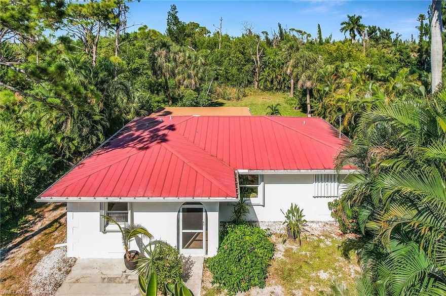 Discover this beautifully remodeled 3-bedroom, 2-bath home nestled on an oversized lot in the desirable St. James City. With lush vegetation and plenty of privacy, this property offers a serene island retreat with all the convenience for waterfront living. Boating enthusiasts will love the location: the home is just a few minutes’ walking distance from Tropical Point Park water access, perfect for kayaks and small boats, and provides easy access to explore the surrounding islands. The home features a red metal roof, manually sliding hurricane shutters, and a recently updated interior highlighted by thyme-colored all wood cabinetry and butcher block countertops in the kitchen — warm, modern, and welcoming.  New A/C and Tankless water heater in 2022 and recently replaced lanai screen.
For dining after a day on the water, enjoy local favorites such as The Waterfront Restaurant & Marina, Phuzzy’s Boat Shack, and Low-Key Tiki.
Whether you’re entertaining guests or enjoying your peaceful private oasis, this St. James City home offers the perfect blend of coastal charm, convenience, and boater’s lifestyle. Don’t miss your chance to call this special place your own!