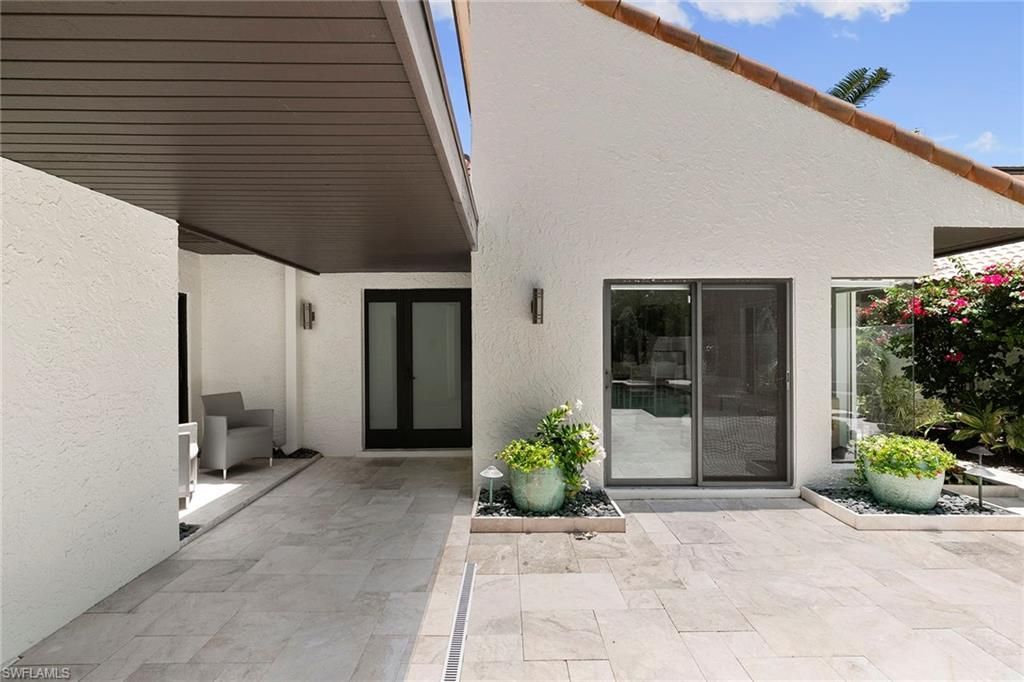 Photo of 580 Tierra Mar LN #21, NAPLES, FL 34108 (MLS # 225068339)