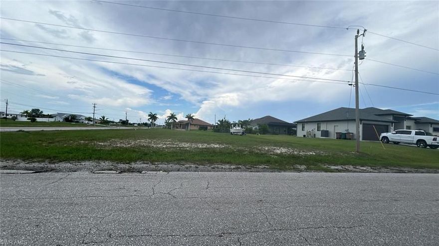 11,250 sf vacant lot permitted and ready to build your dream home! Very good opportunity for builders and/or investors, this lot is ready to start building. Permit and plans are approved (buyer pays impact fees to begin building). The owner has already paid 50% of the trusses for the roof. $13,000 already invested in permit costs - saving you money and months of time in the building process. 

LOCATION LOCATION! A beautiful corner lot in a nice quiet area of Cape Coral. Perfect to build, or buy and hold! Approximately 2 miles from the city’s upcoming Burnt Store 300 project. Dedicating 300 acres to office and flex spaces, guaranteed to bring in more residents and jobs. Also, approximately 3 miles from Pine Island Road Corridor, which is a main focus for the city's development project.