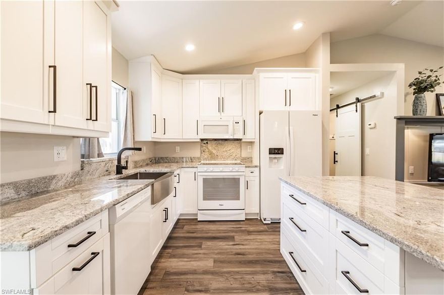 Forget Building! This home has been upscale updated w/ a list so long my fingers hurt typing. City Utility is in.  Gather w/ family & friends in this bright open floor plan. Vaulted ceiling new 42” upper cabinets w/ self-close door/draws, granite counters, kitchen island w/ breakfast bar, luxury vinyl flooring. New Roof 2017. New gutters, AC, Plumbing, Water Heater, 22ft wide Driveway and new Walkway Pavers.  All appliances less than 2 yrs to include full size stack W/D. New Conventional/Convection oven. Lutron Smart Home Lighting, LED energy savings lights throughout, house locks all one key SmartKey Security Locks, Kitchen USB kitchen. Baseboard (8” in Liv area & 5+ BR’s), window & door casing throughout.  Wainscoting in Dining. Fireplace to take the chill off those (very few) chilly nights. Relax in the pool w/waterfall or gather with friends & family for a cook out on the screened under truss lanai.  South Exposure home w/in ¼ mi of boat ramp with a 9” fixed bridge.  You are 25 minutes from open water.  Shed on property, air compressor, all window treatments, and fans remain with property.  Garage has pull down, multiple cabinets, and stores Hurricane Shutters.