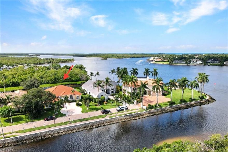 Calling all Boaters, Nature Enthusiasts, and Privacy Seekers! Experience the true beauty of SW Florida’s coastal wonders! Don't miss this opportunity to live on the exclusive Island at Southpointe in Windstar. This beautiful home is one of only 10 estates on this private gated island on Naples Bay with quick direct boating access to the Gulf. This half acre lot and home has spectacular views of Naples Bay being the 3rd house from the island's tip.  The 2000+ sq.ft. lanai w/ a large pool & spa offers multiple areas for serene and private enjoyment of the lush mangrove and Bay views. 4 bedrooms and a separate office ensure space and privacy for you, your family, and friends. A private boat dock with a 6,000 lb lift sits behind the home for a smaller vessel, jet ski, or kayak. The possibilities are endless to create the sanctuary of your dreams. Slips are available in the Southpointe Marina, only moments away, and can accommodate yachts up to 70 feet.  The amenity-rich Windstar on Naples Bay is Naples only gated golf community with its own private deep-water Marina.  Windstar offers an exceptional living experience, nestled in the vibrant Bayshore Arts District of Naples. Just a short drive from Downtown, Naples’  renowned 5th Avenue South, and the pristine sugar sand beaches, this community combines cultural richness with coastal elegance. Residents enjoy unparalleled amenities, including a private Tom Fazio-designed 18-hole golf course, a newly completed $14 million Clubhouse renovation, tennis, bocce, and a private beach club on Keewaydin Island with daily shuttle service aboard Windstar's exclusive Keewaydin Queen. Additional perks include sunset cruises, a water taxi to downtown waterfront restaurants, and more. This is a rare opportunity to own a sophisticated coastal estate with an extraordinary location and amenities. Golf and Social memberships are separate and not required. This home sustained NO damage from Hurricanes Helene or Milton! The home's elevation certificate and proof of flood insurance (transferrable) are available upon request.  Compare the price of this exquisite property to any comparable sized home or empty .5 acre lot with a sensational view, direct access to the Gulf, and optional amenities here in Naples - you won't find a better value!  This is an opportunity to create a showstopper sanctuary like no other currently available!