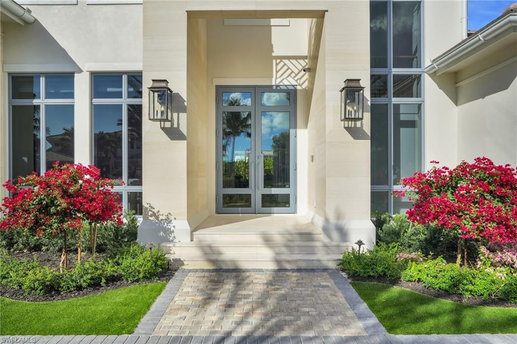 Photo of 555 Whispering Pine LN, NAPLES, FL 34103 (MLS # 226000107)