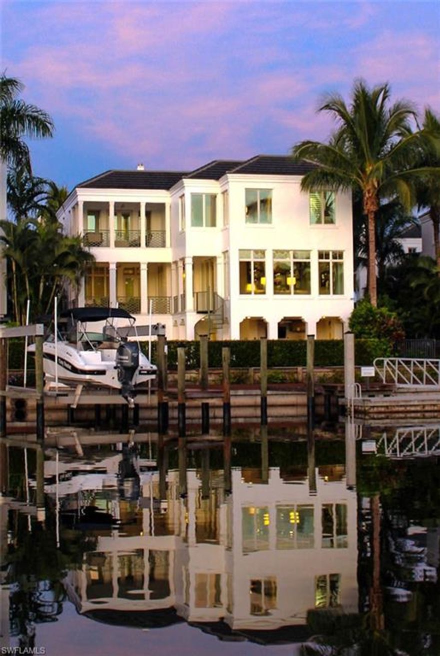 Welcome Home! This is an unbelievable opportunity to live directly on the Bay and right across the street from the beautiful Gulf beaches. The 4 bedroom and 4.5 bath residence was professional designed with the highest quality of finishes. It offers over 4,100 sq. ft. of premium living, including top of the line cabinetry, wood flooring, furnishings, and a state of the art sound and entertainment system. The layout offers wonderful entertaining areas both indoors and outdoors. One needs to only stroll across the street to access the sugar sand beach via your own private access or you can step aboard your boat located in your backyard. The boat slip is equipped with a lift for up to a 40 ft. boat and waters offer 11 ft clearance. The 4 car garage and the set-up for adding a full house generator complete this package. Location is just minutes away from Fine Dining and Shopping on Fifth Ave. South and 3rd Street South. Come and make your dreams come true!!