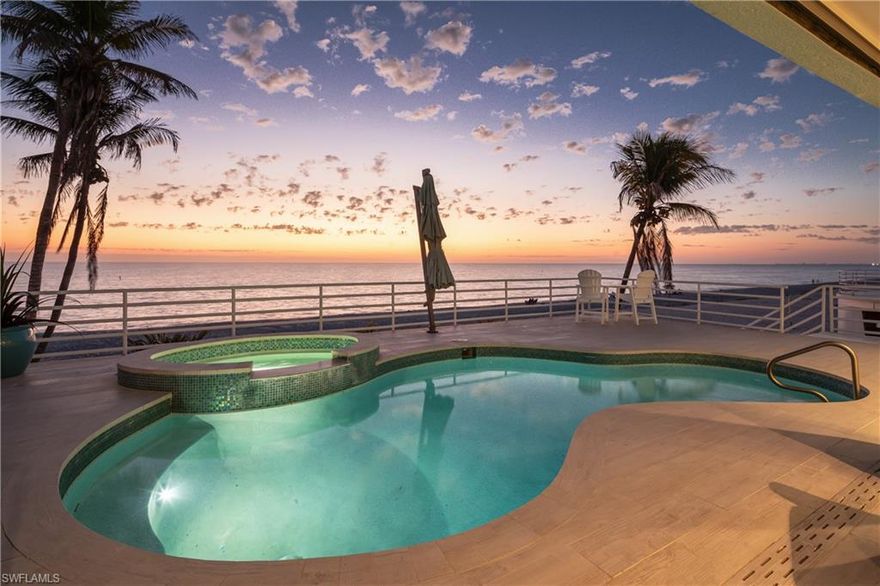 Beautifully remodeled & coastal contemporary beachfront cottage on a rare oversized lot with 63 feet of frontage, offering breathtaking, panoramic views of the Gulf. Ideally located on the highly sought-after Bonita Beach, this home features unobstructed vistas of the turquoise waters and pristine white sands from the ELEVATED POOL DECK. Boasting a bright, airy interior that exudes coastal charm, this home features soaring ceilings, gorgeous wood-look tile flooring throughout, and an abundance of natural light. It’s also equipped with hurricane impact windows and sliders, electric hurricane shutters, and a newer metal roof (2015). The spacious, open-concept floor plan includes 3 bedrooms, den off the primary bedroom, 3.5 bathrooms, a 3-car garage, and versatile ground-floor flex space. Step outside to your private backyard oasis, which features a RARE elevated pool and spa, along with multiple lounging areas and a wet bar with an ice maker — the perfect setting to savor stunning sunsets over the Gulf. The beautiful chef’s kitchen boasts pristine white cabinetry, granite countertops, and high-end appliances. The luxurious primary suite is a serene retreat, complete with a slider enclosed sunroom offering sweeping Gulf views and direct access to the pool deck. The spa-like ensuite bathroom features dual vanities, a spacious open shower, and a freestanding soaking tub for the ultimate relaxation. This exceptional home is ideally located close to top-rated restaurants and is just a 10-minute drive to the Mercato and Promenade, with Waterside Shops, Coconut Point, Naples 5th Avenue, and the International Airport all within easy reach.