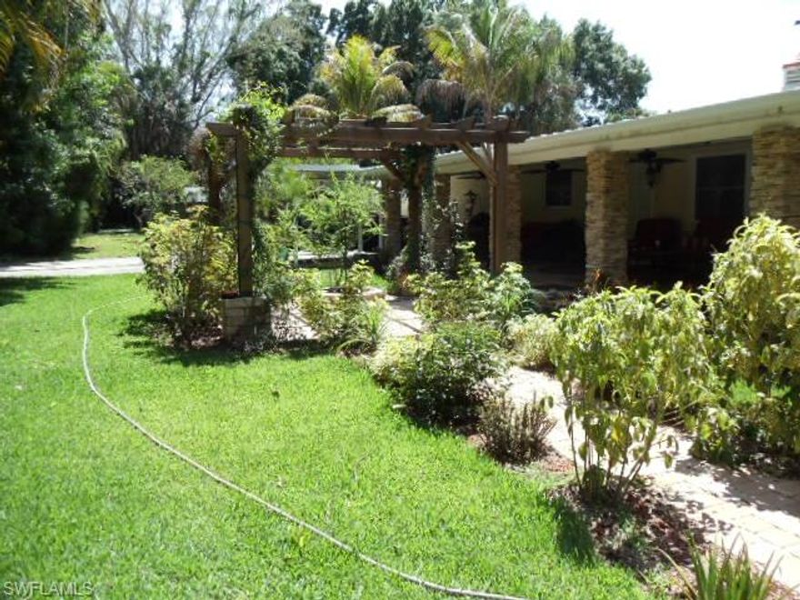 This is a home that must be seen to really appreciate the true value of this property. The home has been completely remodeled and updated with the best materials including new metal roof  travertine stone, walk in shower, granite in kitchen, beautiful stone on fireplace and around outside of home, huge covered patio in rear of home with outdoor kitchen. The detached garage also has a separate mother-in-law suite with full kitchen bath and bedroom
which is now rented for 525.00 per month, and all on almost one full acre. This home could be used for so many different uses because of the 1 full acre of land lots of parking and a 6 car garage you could run a landscape business, construction or hundreds of different types of home business.Also if you have a large extended family or just like the extra income from renting out the one bedroom apartment. If you enjoy entertaining there is lots of room indoors (2720 in the main house and another 1100 in enclosed garage and apartment ) and even more outdoor porch and lanai areas ( over 1500 sq ft ) make an appointment to see this very unique property