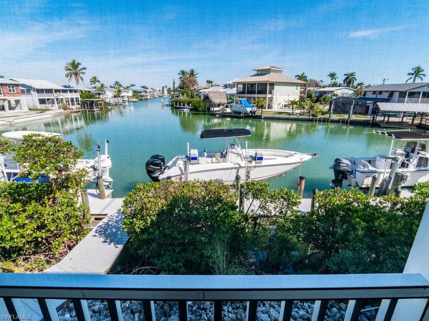 NEW DOCK, NEW LIFT IN THIS DIRECT GULF ACCESS 4-bedroom, 2-bathroom waterfront home. A true boater’s paradise dream with direct access to 10,000 islands, known for top backwater and offshore fishing. This spacious home boasts expansive water views and an open-concept living area filled with natural light, ideal for entertaining or simply enjoying the tranquil surroundings. Recent upgrades include impact-rated windows, doors, a new roof, and a new garage door. Large screened lanai offering the perfect spot to enjoy the beautiful bay views. With a gigantic oversized garage, plenty of storage, and ample space for your boats, trailers, or golf carts, this home combines a beach vibe and convenience. Located just minutes from popular local spots like Stan’s and Little Bar, and only a short drive to Marco Island’s beaches and shopping, this is the ultimate waterfront retreat. Don’t miss your chance to own this exceptional property in one of the area’s most desirable location!