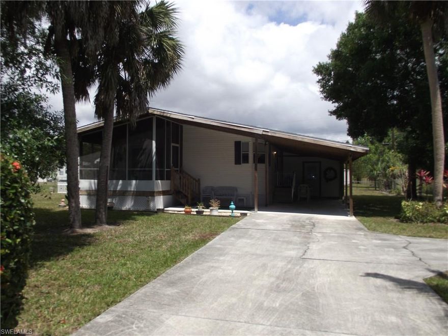 Lots of yard with this well kept '94 2 bedroom 2 bath manufactured home. Situated on over a third of an acre fully fenced yard in Oak Creek Manor in Bonita Springs. Large Oak trees and mature landscape give a feeling of quiet seclusion on this end of the road home. Well located just south of Bonita Beach Road off Imperial Parkway, close to Interstate 75, shopping, restaurants with a short drive to Bonita Beach. Offered fully furnished. Just bring your personal items and move in. BSU water and sewer assessments are paid in full.If you are looking for a great home in a private setting this is the one for you.
