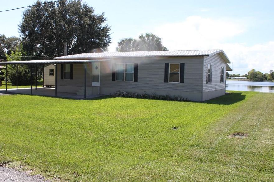 LET'S SEE what's being RENEWED in LAKEPORT ~ It's a 1984 3Bd/2Ba DWMH on a Captured Lake ~ Great Sunset from Screened Room. NEW Roof, Vinyl Siding & A/C in 2013. I like it.  Interior laminate flooring.  Wall texture & paint updates are completed ... New Kitchen Cabinets & Appliances include Refrigerator, Electric Range and Dishwasher.   2-Car Covered Parking & Concrete pad.  Small attached Shed and Large Detached Shed included.