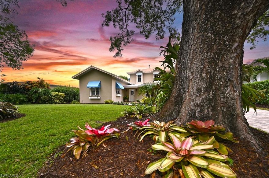 Olde Naples Charm, a stones throw from the beach, 83' x 150' /.29 acre lot with 11ft+ elevation. Step inside & feel the Positive Energy of Yesterday blended with Today's Design; Comfortable, Spacious & Conducive to Indoor/Outdoor Living. The front 1700sf of the residence was built in 1958 & expanded/enlarged in 1999. Timeless design elements remain with  tongue & groove plank cathedral ceilings, exposed beams & (recently discovered) terrazzo flooring within a charming attached 1BR/1B wing w/ kitchenette, sitting area & a private entrance. Perfect for guests, artist studio or office. This home has been smartly combined & redesigned with a great flow.  The kitchen, just off of the den/family room, leads to an oversized butlers pantry then into the dining/gathering area. Impact French doors & transom windows flank the space creating a natural botanical feel mimicking the gardens surrounding the home. The sitting area, originally designed as a game room, opens onto the screened lanai & pool.  Upstairs is an amazing Master Suite & two large ensuite bedrooms, each with spacious balconies where sipping morning coffee before heading to the beach or Fifth Ave via the rear private alley.