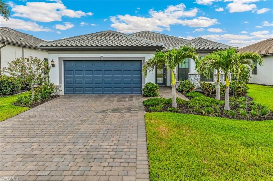 This beautifully upgraded Mystique model offers the perfect blend of comfort, style, and Florida living. Featuring a desirable stone elevation and a welcoming glass insert front door, the home makes a striking first impression.

Inside, you’ll find 2,264 square feet of thoughtfully designed space, including three bedrooms, a versatile den, and three full baths. The open-concept great room features a tray ceiling and flows seamlessly into the main living areas, all enhanced by crown molding and upgraded 5 1/4-inch baseboards throughout. Eight-foot interior doors add to the spacious feel.

The kitchen serves as the heart of the home, complete with quartz countertops, 42-inch white cabinets, a large island, and custom lighting. The appliance package includes Whirlpool appliances, a gas cooktop, and a wall oven, making it ideal for both everyday living and entertaining.

The owner’s suite offers a private retreat with a tray ceiling and a custom-designed walk-in closet with built-in shelving. The en-suite bath includes a large walk-in shower with dual shower heads, dual vanities, and quartz finishes.

Outdoor living is just as impressive, with a west-facing lanai that captures beautiful sunset views over a long lake. The space is designed for year-round enjoyment and includes a saltwater pool, picture-frame screen enclosure, storm shutters, ceiling fans, TV setup, and a dedicated outdoor wireless access point.

Additional features include impact glass windows and sliders, plank-style tile flooring throughout, a laundry room with sink and white cabinetry, a two-car garage with a four-foot extension, epoxy flooring, and its own mini-split air conditioning system. The home is equipped with a Lennox PureAir HVAC system with advanced carbon clean filtration.

This home is move-in ready and is SOLD FURNISHED, WITH A SELF PLAYING BABY GRAND PIANO, subject to a few exclusions.

Verdana Village is one of the most sought-after upscale communities, offering an exceptional lifestyle with indoor basketball, indoor and outdoor pickleball, tennis, and even an ice cream parlor. Residents enjoy multiple resort-style pools, a hot tub, bars, and restaurants with outstanding culinary options. For added convenience, you can ride your golf cart to Publix, a liquor store, UPS, a nail salon, an award-winning hair salon, Dunkin’ Donuts, physio services, an Italian restaurant, and additional commercial amenities planned for the near future.

Come and enjoy the Florida lifestyle. A beautiful home with all the bells and whistles, set on a premium lot with stunning lake views in a vibrant, growing area. Designed for the most discerning buyer, this is a place to truly call home.