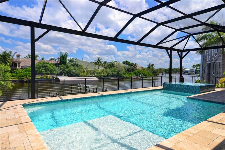 if you have been looking for a beautiful Coastal Design Gulf of Mexico waterfront access home that is walking distance to the beach - it is now available. This 2017 home is situated directly on the Imperial River & is just minutes by boat to the gulf either to the North or South.  This quiet serene riverfront setting can be enjoyed from the deck of the elevated pool and spa or the spacious back yard that leads to the double boat docks, each with a 10,000lb boat lift and one is covered. The best of finishes and furnishings throughout the home are all included.  Features include wide plank white European oak flooring, custom cabinetry, hand selected high level countertops, tile, wall treatments, designer plumbing and lighting fixtures and top of the line appliances.  Large pocketing sliding glass doors in the grand room capture views of the flowing water of the Imperial River & lead to a covered lanai with fireplace, outdoor grill and a very large elevated pool and spa. The main floor master has direct pool access and river views & large office.  Three guest bedrooms with en suite baths plus a cloud rec room with large covered lanai. 3/4 car garage with additional car or toy storage.