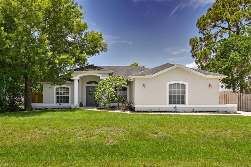 Move-In Ready and Updated! This 3 bedroom, 2 bath, 2 car garage home features tile floors throughout living areas, laminate wood flooring in all bedrooms, vaulted ceilings and decorative plant ledges. Kitchen has granite counters and stainless steel appliances. The master suite is spacious with a walk in closet, large shower and dual sinks. Open concept floor plan with dining area, breakfast nook, bar and spacious living room. Laundry room and side load two car garage. Extended driveway for parking your boat, RV or additional vehicles - the fence has a 10FT double gate. Enjoy the fully fenced and private backyard from the screened lanai or open porch while you grill with a custom open grill! New fence 2019, AC 2015, well pump 2018, well equipment updated 2019, exterior painted 2020. This one will not last, make an appointment today!