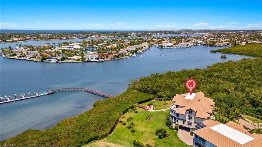 Welcome to 1530 Star Point Lane in the highly coveted enclave of Admirals Watch of Windstar on Naples Bay. Enter the lobby of this 4-unit boutique building to the elevator which opens directly into your sprawling 4 Bedroom/4.5 Bathroom 2-story penthouse home in over 5000 square feet of living space with gorgeous, expansive southwestern views of golf course, Naples Bay, Port Royal, Royal Harbor and endless sunsets.  This exceptional unit comes with a deeded boat slip ideal for boat lovers.

Elevator opens you directly into your unit with a dramatic entry foyer with a gorgeous staircase.  Open-concept living space with lovely living and dining rooms.  Spacious eat-in kitchen replete with white shaker cabinetry, granite countertops, stainless steel appliances and custom beams is truly an entertainer's dream.  Breakfast area directly overlooking the bay.  Comfortable media room plus a home office with custom built-ins both with dramatic views, powder room plus 2 gracious guest suites.

Ascend via the stairs or elevator to your Master Suite Oasis featuring a large bedroom with a wall of glass opening out to balcony with the most glorious views, en-suite bath with walk-in shower, soaking tub, separate vanities and separate water closet. Large walk-in closet with custom built-ins.
Additional guest suite currently set up as a sitting room would also make a fabulous dressing room with additional full bathroom creating a truly luxurious Master Floor Oasis.

3-car attached garage.  Deeded boat slip #1 behind the building which can accommodate up to a 30 foot boat and is just a mere 7 minutes out to the Gulf of Mexico.  Gorgeous resort-style pool.
Windstar on Naples Bay is the only gated golf community with Tom Fazio designed 18-hole golf course that offers direct bay access, a private beach plus dock on Keewaydin Island with boat shuttle plus a full service 73-slip deep water marina.  Newly renovated clubhouse (separate membership) with multiple dining areas with stunning views of Naples Bay and Port Royal, game room, 6 Har-Tru tennis courts, 3 bocce courts and a state of the art fitness center slated for late 2026 completion.
Preferred location just a short drive via car, bike or golf cart to downtown's 5th Avenue known worldwide for its fine dining, shopping and beaches.  Situated in the vibrant Bayshore Arts District, Windstar is walkable to Naples Botanical Garden and Naples Pickleball Center home of the pickleball US Open.  Easy access to I-75, Naples and Fort Myers airports.  This exceptional home is truly a rare find.