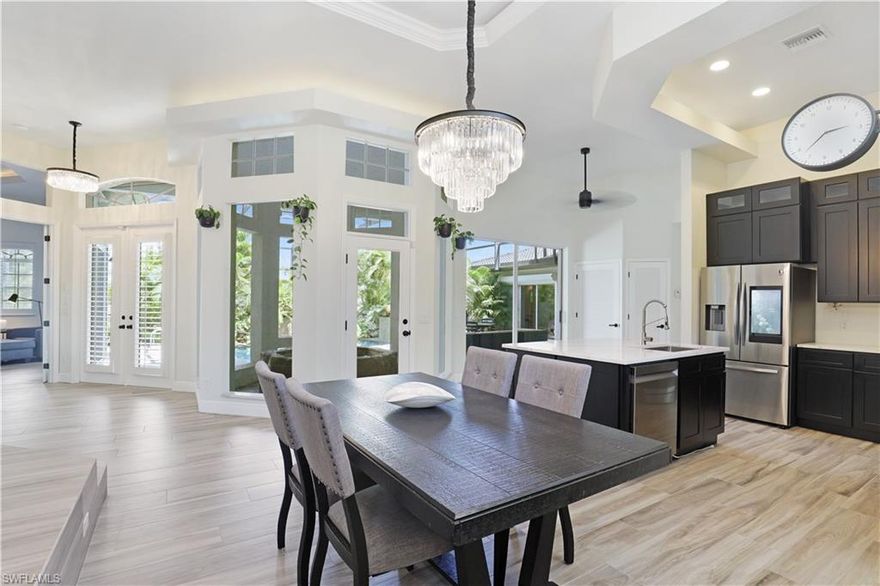 Private waterfront 3 bdrm includes cabana w/ full bath & sitting room (or office space). Enjoy your gorgeous, private biophilic lanai & lagoon style saltwater pool, newly remodeled home sits on 11,979 (sqft) lot. Stunning 200+ canal views from the den, side lanai & deck, tiki & 2 boat lifts, 10 & 13,000 lbs. The pedestal living room boasts glass views bringing the outside in.  After boating, enjoy your very large private lanai for a soak in your spa or heated saltwater pool w/ 2 waters features. Entertain your guests, family/in-laws for the evening then send them to their very own suite/cottage with private bath/pool bath. Some Highlights: 2 AC units/2 Hot water heaters, Solid Wood, dovetailed jointed all wood soft touch cabinets. Porcelain Tile Plank floors. New sinks, New Quartz countertops Samsung Kitchen Appl. in Oct. 2021.Refrigerator is a tablet! Oven is a Convection Air Fryer. Watch the kaleidoscope of colors when the sun streams into the dining room & through the Stunning Chandeliers. All bathrooms remodeled! Pool Fan motor replaced 2021.  Exterior Painted in July 2021. Intercom doorbell. Driveway paved & made for 3 cars wide. Lots of closet space & more! Assessments Paid!