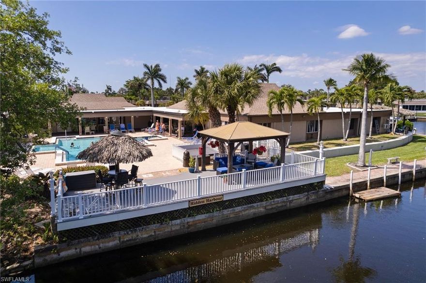 Imagine a place where life naturally slows down, friendships form with ease, and each day feels just a little lighter. This spacious 4-bedroom, 2.5-bath residence offers remarkable flexibility—ideal for hosting visiting family, pursuing hobbies, or simply enjoying the freedom of extra space. The sun-filled Florida room quickly becomes a favorite retreat, perfect for morning coffee, peaceful afternoons, or relaxed evening conversations.

Set within a highly sought-after Gulf-access 55+ community with a private marina, residents enjoy an exceptional lifestyle supported by an impressive array of resort-style amenities. A beautifully maintained pool invites daily relaxation, while the newly updated fitness center, complete with a hot rock sauna, private showers, and dressing rooms, delivers a true spa-like experience.

Creative and social opportunities abound with dedicated hobby spaces for stained glass, sewing, painting, jewelry making, and more, alongside a welcoming library, billiards room, game room, and outdoor favorites such as corn hole. Boating enthusiasts will appreciate the private marina with tiki hut, an ideal gathering spot to unwind by the water, as well as a fully equipped community workshop available for resident use.

Whether you’re a snowbird seeking a warm seasonal escape or an empty nester ready for a comfortable next chapter, this community offers the freedom to be as active or as private as you choose—a place where neighbors become friends, and friends truly feel like family. Nearly everything is included, offering a simplified and predictable lifestyle, with electric as the primary [some exclusions apply to turnkey]