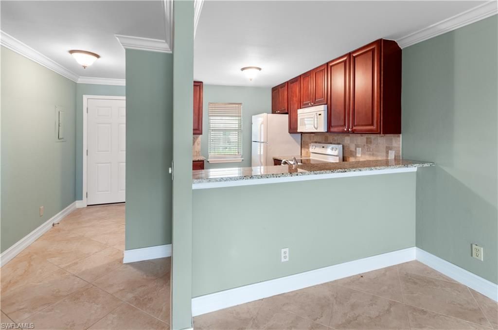 Photo of 829 W Elkcam CIR #2-208, MARCO ISLAND, FL 34145 (MLS # 226017932)