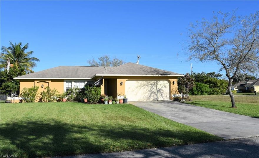 This is an excellent opportunity to own a house in SW Cape Coral area. Central water & sewer, and assessments paid in full. This proud owner has improved this house in many ways: new appliances, kitchen cabinetry (wood), granite countertop, mature landscaping, irrigation system/dual water, hurricane panels, and recently fenced. Reverse osmosis water system. Tile and laminate flooring throughout the house, screened lanai, room for a pool, laundry in residence, and plenty storage through the house. Come and see it now!