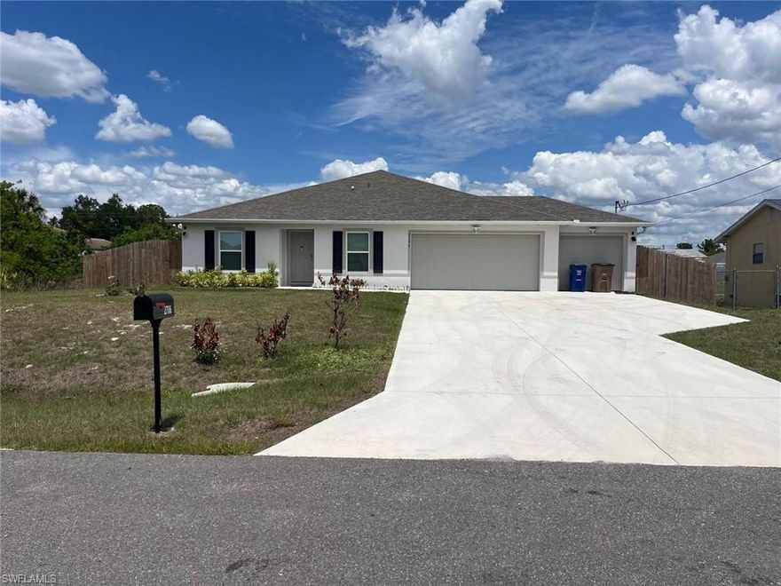Welcome to this beautifully built 2024 ranch-style home offering modern comfort, space, and privacy on a generous 10,892 sqft fully fenced lot tucked away on a quiet private street in Lehigh Acres. Boasting 1,805 sqft under air, this 4-bedroom + den, 2-bath home with a 3-car garage features an inviting open-concept layout with spacious living and dining areas, a large breakfast island, abundant cabinetry, and plenty of prep space for cooking and entertaining. The versatile den/office is perfect for working from home, a playroom, or flex space. Enjoy peace of mind with a whole-house reverse osmosis water treatment system and relax year-round on the spacious screened back porch overlooking the fully fenced backyard. The oversized paved driveway accommodates 6+ vehicles, ideal for guests or extra parking. The generous primary suite easily fits a king-sized bed and features a walk-in closet and private ensuite bath. Ideally located just 4 minutes from HCA Florida Lehigh Hospital and only 3 minutes to Walmart Supercenter, with shopping, dining, and daily conveniences nearby. This move-in ready home blends style, function, and location—an exceptional opportunity to own your Florida dream home!