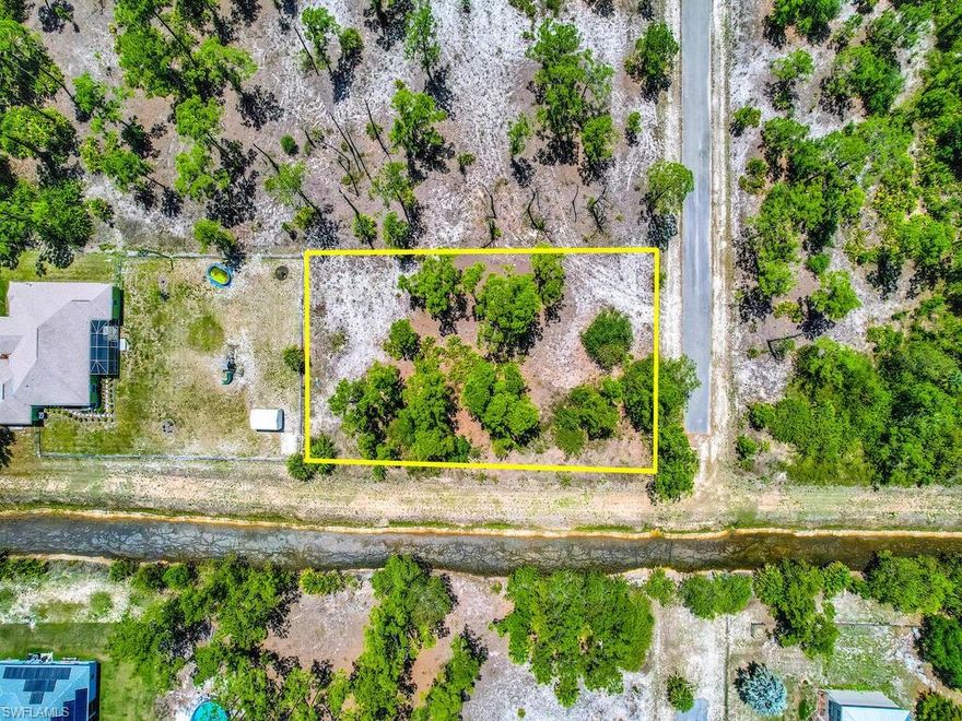 WOW! 1/2 of an acre available and located minutes from State Road 80 and I-75. Nice private lot at the end of the road and on the canal. Close to schools, parks and churches! Comes build your perfect SWFL home!