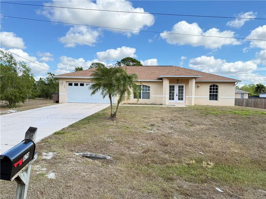 Recently painted interior- 3 bedrooms + a den 2 bathrooms 2 car garage with laminate flooring throughout and a screened in lanai.  Located in popular East Lehigh with easy access into town and SR 82 to get to Fort Myers.
