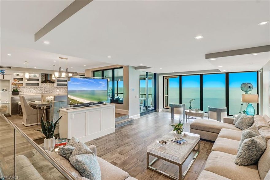 One year of free Condo Fees and a 1 year Choice Home Warranty at closing to the future Owners at closing! Enjoy Gulf views galore the minute you step into this tastefully remodeled 18th floor Condo! Serenity and luxury abound in this modern unit with exquisite attention to detail in absolutely every aspect. Engineered Wood floors flow throughout the living areas and guest room with custom lighting fixtures around! Expansive floor to ceiling impact windows with turtle glass allows abundant natural light to flood into the entirety of the space. Custom ‘Warendorf’ Cabinets by SOHO with touch latch drawers, 2 cooling drawers, ‘Dacor’ Refrigerator and Induction Oven only sweeten the Deal with a stunning view from the kitchen! The screened-in lanai allows you to not just see the Beach, but also enjoy the sounds of the waves and the sweet smell of salt water!  2 Parking spaces are included in a covered garage! The Resort-style amenities include 24/7 gate/guard house & lobby entrance with concierge, a heated pool/spa, pool-side cabana & grilling area, a social room with full-service kitchen prime for large events, 56-seat movie theater, roof top lounge, guest suites & more.