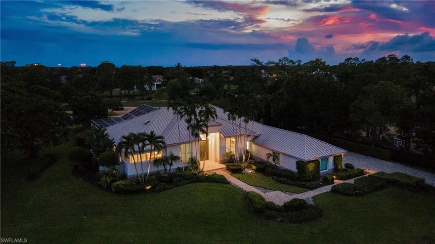 Come experience the understated luxury of this 4-bedroom, 4-bathroom Quail Creek estate home. Reimagined in a modern coastal style that perfectly complements its surroundings, this home stuns with soaring 14’ ceilings and an abundance of sliding glass pocket doors that dissolve the boundaries between indoor and outdoor living. Designed to meet the needs of today’s dynamic lifestyles, this home is the perfect balance of an open floor plan and designated spaces tailored for family engagement, productivity, and privacy. The kitchen is a chef's paradise featuring dual islands and equipped with top-of-the-line appliances, and the dining room is a space you will actually use – open to the kitchen, light and bright. Or dine al fresco on the covered lanai as the retractable pergola roof ensures a perfect meal rain or shine. A theater room, library and game room offer space to entertain, relax or work. Take advantage of the beautiful SWFL weather lounging by the pool, savoring the tranquility of panoramic golf course views on the over 1500 sf screened lanai. Marvel at spectacular sunset views and end the day gathered around the fire pit to share stories and create lasting memories. The life you’ve always imagined is possible in this beautifully renovated haven!