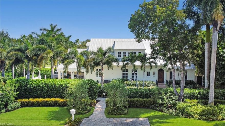 This enchanting Old Naples residence is steps from the renowned sugar sand beaches that make Naples famous. Thoughtfully designed and built in 2008, the home features a dramatic vaulted pecky cypress tongue & groove ceiling and a wood-burning fireplace in the living room. The chefs kitchen is equipped with Subzero, Thermador & Wolf appliances. Large covered lanai with retractable screens & shutters leads to a lushly landscaped private saltwater pool, spa & great entertaining space. Generously sized ground floor primary bedroom suite features 2 walk-in closets, dual vanities, soaking tub & separate glass enclosed shower. Two additional guest bedrooms, each with its own private bathroom, an office & family room on the second floor provide luxurious accommodations for family & friends. Other luxuries include a private elevator, natural gas generator, 2 zone heating & cooling, & impact resistant windows. This well-appointed residence lives like a charming tropical retreat & is located on beautiful 3rd Avenue North. The perfect location for the buyer who seeks the convenience of being within walking distance to Gulf beaches as well as the many attractions of downtown Naples. A MUST SEE!