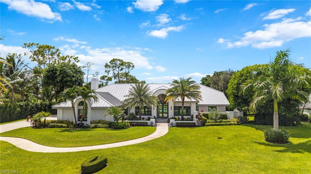 Photo of 13029 Bald Cypress LN, NAPLES, FL 34119 (MLS # 225067647)