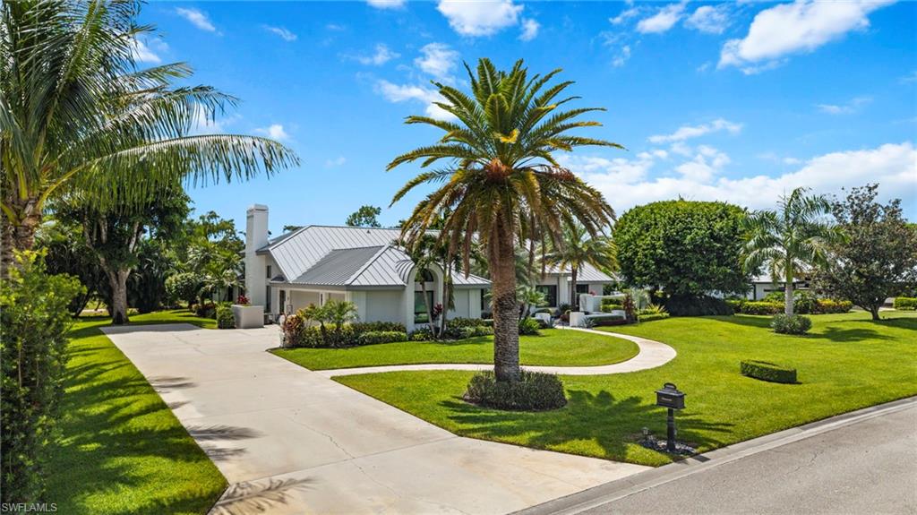 Photo of 13029 Bald Cypress LN, NAPLES, FL 34119 (MLS # 225067647)