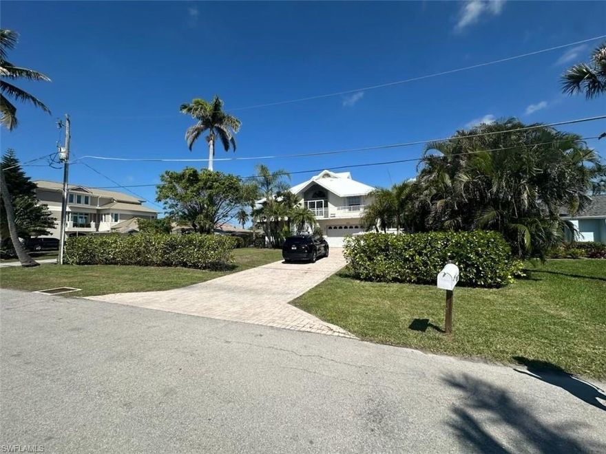 This amazing raised three story waterfront home is on the best side of the island of Capri with quick access to the Gulf. The house features a stunning remodeled Kitchen with views of the canal and sunsets from all the windows that face the huge wrap around deck. The home has three bedrooms and three bathrooms on the main floor. The top floor is a large open loft with closets and access to a deck and is currently being used as a bedroom. 
The ground floor efficiency unit has its own kitchenette and full bathroom which also serves as the pool bathroom. 
There is a large covered porch porch downstairs next to the pool that provides shade on those hot Florida days. The pool and hot tub sit next to an outdoor kitchen.  The property is very well taken care of and ready to move in.
