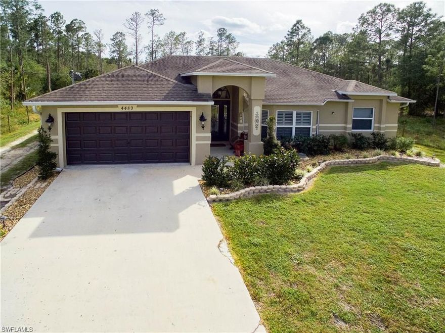 Beautifully maintained 3-bedroom + den, 2-bath home with a 2-car garage, ideally located on a quiet dead-end street. This split-bedroom floor plan offers both privacy and functionality—perfect for a growing family. Each bedroom features walk-in closets and updated flooring, while tile runs throughout the main living areas.
The kitchen is equipped with stainless steel appliances, Corian countertops, and a reverse osmosis system at the sink. Additional interior upgrades include plantation shutters in the living room, wood blinds throughout, and a newer high-efficiency A/C system.

This home has been thoughtfully upgraded with hurricane impact windows, a new roof, fresh interior and exterior paint, a new water system, alarm system, and upgraded garage flooring. Enjoy outdoor living with a spacious screened-in area, fire pit, wide driveway, and beautifully maintained landscaping.

Situated on 2.73 acres (including an adjoining lot), the property is fully fenced with an electric gate, offering privacy and plenty of room for vehicles, equipment, or recreational toys.