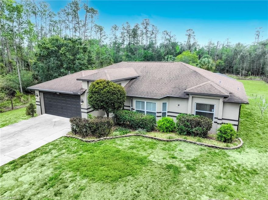 Tucked away on a quiet dead-end street, this 3-bedroom + den, 2-bath home with a 2-car garage is the kind of place that makes life feel calmer the minute you pull in. There’s space to spread out, room to grow, and real privacy—set on 2.73 acres (including an adjoining lot) with a fully fenced yard and gate.

Inside, the split-bedroom layout gives everyone their own space—ideal for a family, guests, or working from home. The main living areas feature easy-care tile, while the bedrooms have updated flooring and walk-in closets. The kitchen is practical and polished with stainless steel appliances and a reverse osmosis system at the sink—perfect for everyday living and entertaining.

You’ll feel the pride of ownership in the upgrades: impact windows, a new roof, fresh interior and exterior paint, a newer high-efficiency A/C, a new water system, and upgraded garage flooring. Plantation shutters and wood blinds add a clean, finished look throughout. And for extra peace of mind, the home includes a portable whole-house generator that conveys with the property.

Step outside and you’ll understand why this property is special. Enjoy a large screened-in outdoor area, a fire pit for evenings under the stars, a wide driveway, and beautifully maintained landscaping. And with all this land, you’ll have plenty of room for vehicles, equipment, or the toys that come with the Florida lifestyle.

If you’ve been looking for a home that feels private, updated, and ready to enjoy—this one checks the boxes