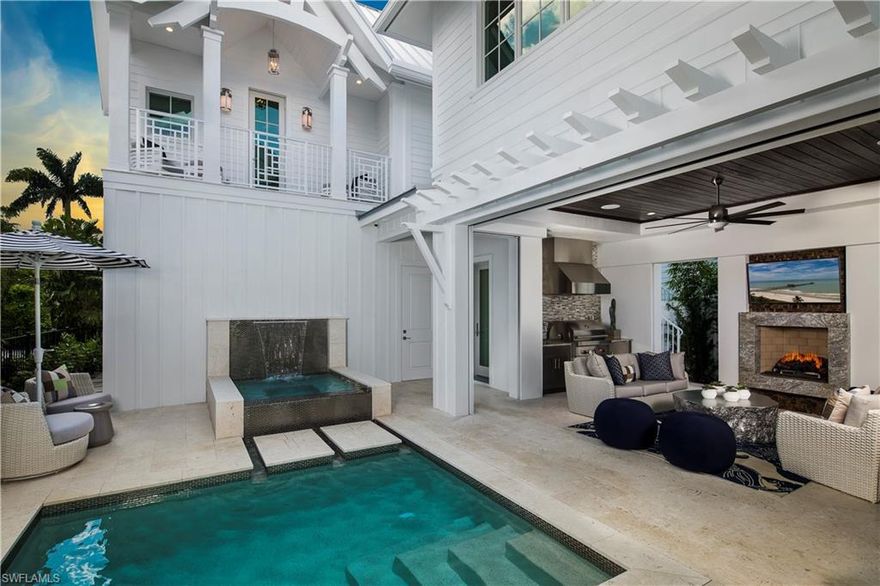 STOCK CUSTOM HOMES and MHK bring its superior quality of custom craftsmanship to Olde Naples with the Residences On Sixth-a coastal contemporary look featuring a layered neutral color palette that is light, airy, and consistent. Designed for indoor- outdoor living. Features Include: Master suite on first floor with private laundry, Cabana bedroom with private entrance, three car garage, reclaimed light oak flooring throughout. Kitchen equipped with sub-zero, wolf, miele appliances and floor to ceiling custom cabinetry. Full outdoor kitchen includes wolf grill  and naturekast cabinets. Covered lanai with fireplace has custom roll down shutters and screens. The outdoor living area includes a sheer descent LED waterfall into the spa. Enjoy the heated salt generated pool and spa and custom landscaping with an outdoor pool bath. Energy efficient, low maintenance, Andersen impact windows and doors, a 500 gallon LP gas tank, smart home automation, central vac. Walking distance to beach and 5th Ave.