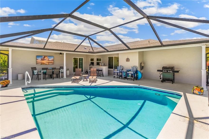 Beautifully remodeled coastal style pool home in a boating community. Scenic 25 min ride to Lover's Key and the gulf! Community boat ramp/dock. This home has been completely remodeled within the last 3 years. This home is pristine and EVERYTHING HAS BEEN UPGRADED! Offering an open concept floor plan, this home has new plank tile flooring throughout, crown molding and tall baseboards throughout the home, modern LED ribbon lighting, a remote controlled electric fireplace with multiple color settings, all windows and doors are hurricane rated impact glass. Kitchen is light and bright with white wood Shaker cabinets, quartz counters, extra built-in cabinetry including a large coffee bar with quartz counters, new stainless-steel appliances. The baths have new vanities with quartz counters, mirrors with integrated LED lighting and showers with custom tilework. Heated pool with large deck space and an outdoor bar. Other upgrades in 2023 include: new roof, new insulation, new HVAC, new water heater, all new plumbing, all new wiring, new ceiling fans and light fixtures, new commodes, new WIFI garage door with camera allows you to open and close from anywhere. This home has been tastefully appointed and is a must see. Most furniture available separately. Enjoy a great neighborhood that offers a community boat ramp. Catch a snapper off the dock. Play a game of pickle ball, tennis or basketball. Playground. Low HOA fees of $240/ year. Boats and RVs are allowed here! Island Park Woodlands has community events like 4th of July golf cart parade, Harvest festival, Easter Egg hunt and more.