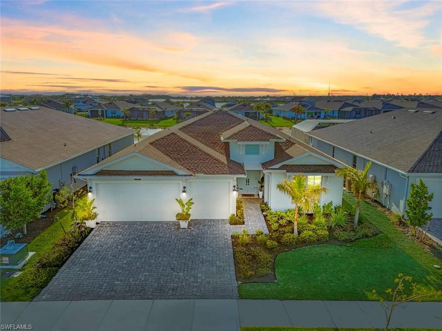 Welcome to luxury living at its finest in beautiful gated Waterview Landing! This stunning Tamiami Costal model home by TOLL BROTHERS showcases over $190,000 in upgrades, offering a one-of-a-kind custom feel with impeccable design and detail craftsmanship.

From the moment you step through the grand double-door entry, you’ll be captivated by soaring 10-foot ceilings, 8-foot doors, and exquisite designer finishes in every room. The spacious open-concept living area is enhanced by custom wood beam ceilings, high white shine porcelain tile flooring (no carpet!), and three expansive sliding glass doors that perfectly frame the breathtaking lake and fountain views.

The gourmet kitchen is truly a showstopper, featuring:
Thick quartz island with custom design detail,
36" Cooktop hood with Cabinet upgrades,
Beautiful modern blue cabinetry with soft-close features,
Under and upper cabinet lighting,
Upgraded Kohler faucets and sinks,
Professionally selected lighting and designer drapery.

The primary suite is a private retreat with a tray ceiling and beautiful Engineered Wood Flooring upgrades for a warm feel. The bathroom is spa-inspired complete with floor-to-ceiling tile, dual shower heads with Rainhead luxurious rain shower, frameless shower door, dual sinks and luxury layout.

Guests will enjoy comfort and privacy with two spacious front bedrooms, each with ample lighting and access to a beautifully appointed bathroom with a tub/shower. An additional bedroom features engineered luxury wood flooring and a private en-suite with a walk-in shower.

Step outside to your extended covered lanai under truss, already outfitted for the ultimate outdoor kitchen with water, gas, and electric lines in place—all overlooking a serene lake with a large fountain centerpiece, creating a peaceful and relaxing atmosphere with the soothing sound of water with a exterior full height privacy wall

Additional highlights include:

Tray Ceilings in the Great room with wood beams, master bedroom and foyer tray ceilings,
3-car garage with epoxy floors and extended driveway,
Hurricane impact glass throughout!!!
Security alarm system & Pre-wire for outdoor speakers,
Built-in attic Home Theater Surround speaker Pre-Wire (5 in living room, 2 on lanai),
Large laundry room with utility sink,
Professionally curated finishes and upgrades throughout,
Epoxy coating on garage floor.

This home is truly better than new, offering unmatched value as one of the MOST UPGRADED & BEST PRICES HOME IN WATERVIEW LANDING !
A full list of upgrades and pricing is available upon request. Don’t miss this rare opportunity to own a spectacular custom home.  Enjoy living in Babcock Ranch, America's first entirely solar-powered town, with access to multiple community pools, nature trails & events. Just a short golf cart trip to grocery stores shopping and dining. Beautiful parks and amenities let you experience SW Florida at its finest! Come live a better life at Babcock Ranch!