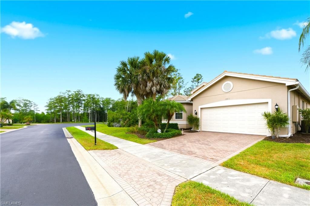 Photo of 10051 Mimosa Silk DR, FORT MYERS, FL 33913 (MLS # 226019993)